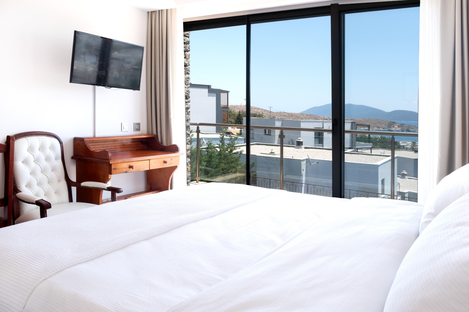 Bedroom with balcony view